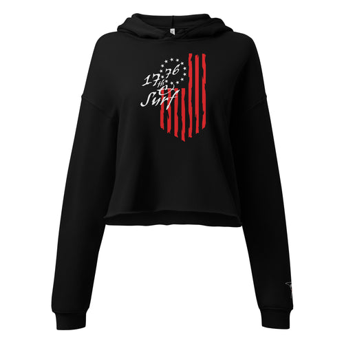 Black "1776 & Surf" crop hoodie, front view, featuring the large 1776 script logo with 13-star Betsy Ross flag and distressed red stripe graphic – America's 250th Anniversary Collection by 17th & Surf