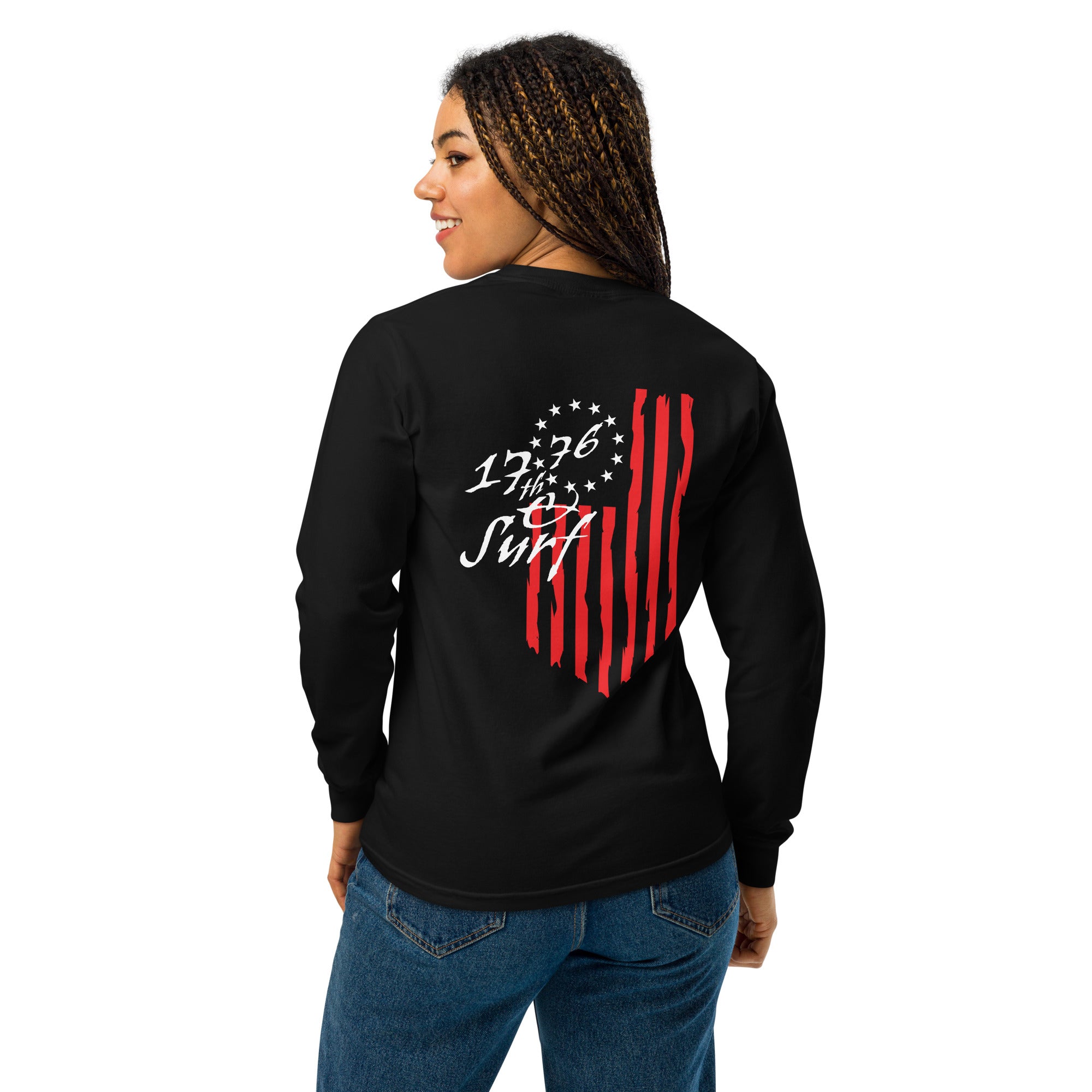 Woman wearing the black "1776 & Surf" long sleeve shirt, back view, featuring the large 1776 script logo with 13-star Betsy Ross flag and distressed red stripe graphic – America's 250th Anniversary Collection by 17th & Surf