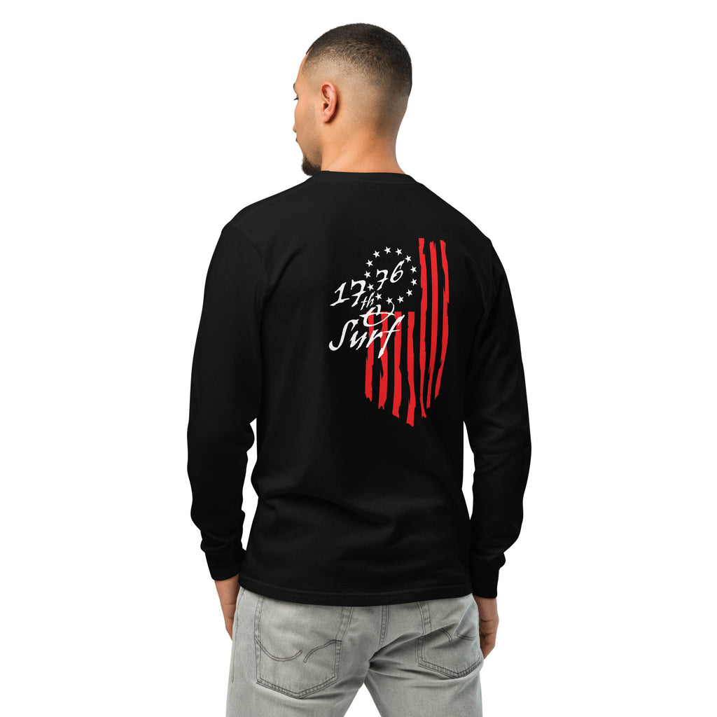 Man wearing the black "1776 & Surf" long sleeve shirt, back view, featuring the large 1776 script logo with 13-star Betsy Ross flag and distressed red stripe graphic – America's 250th Anniversary Collection by 17th & Surf