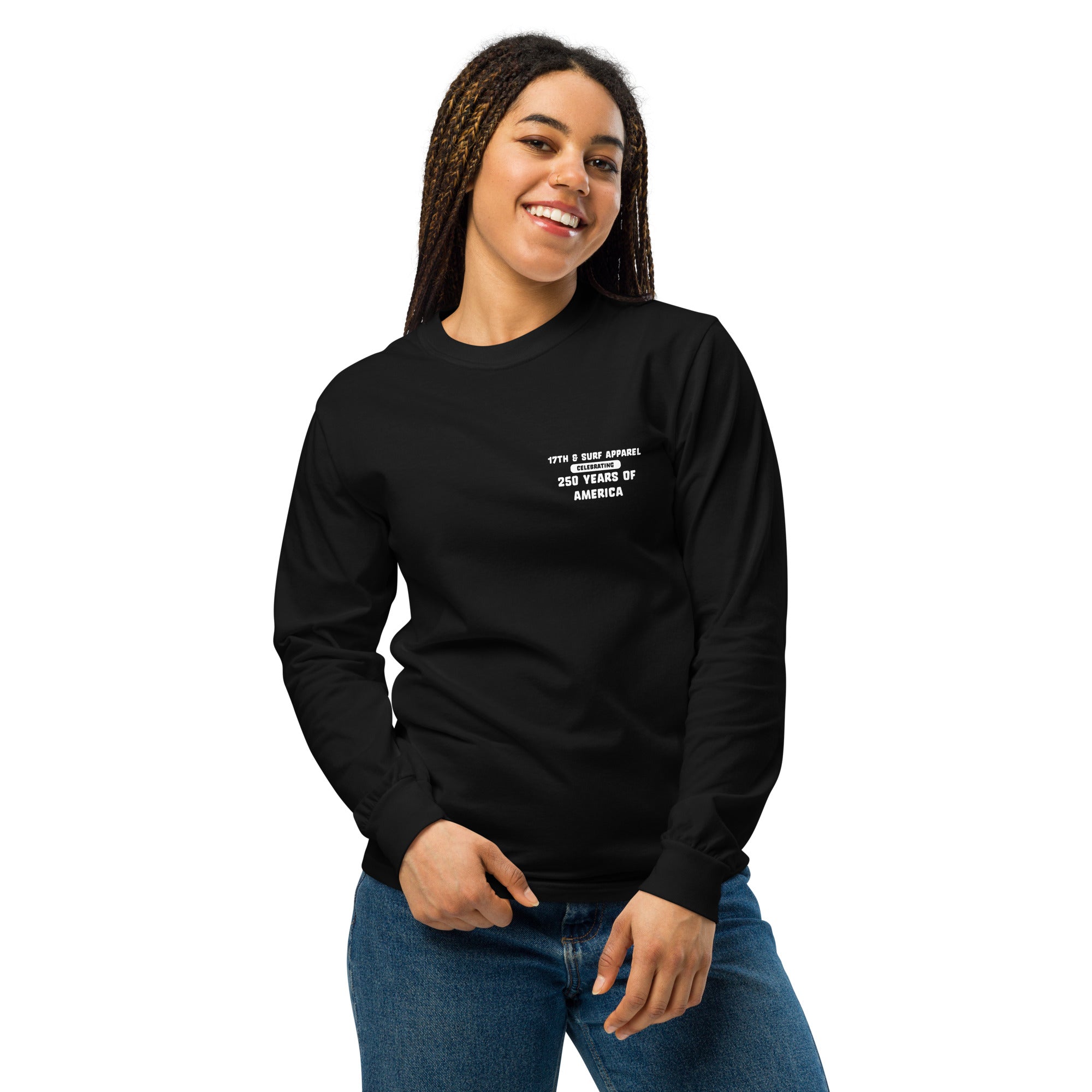 Woman wearing the black "1776 & Surf" long sleeve shirt, front view, featuring the small '17TH & SURF APPAREL Celebrating 250 Years of America' chest wordmark – America's 250th Anniversary Collection by 17th & Surf