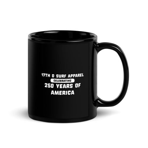 Black 1776 & Surf coffee mug with handle on the right, printed with the 'Celebrating 250 Years of America' text – America's 250th Anniversary Collection by 17th & Surf