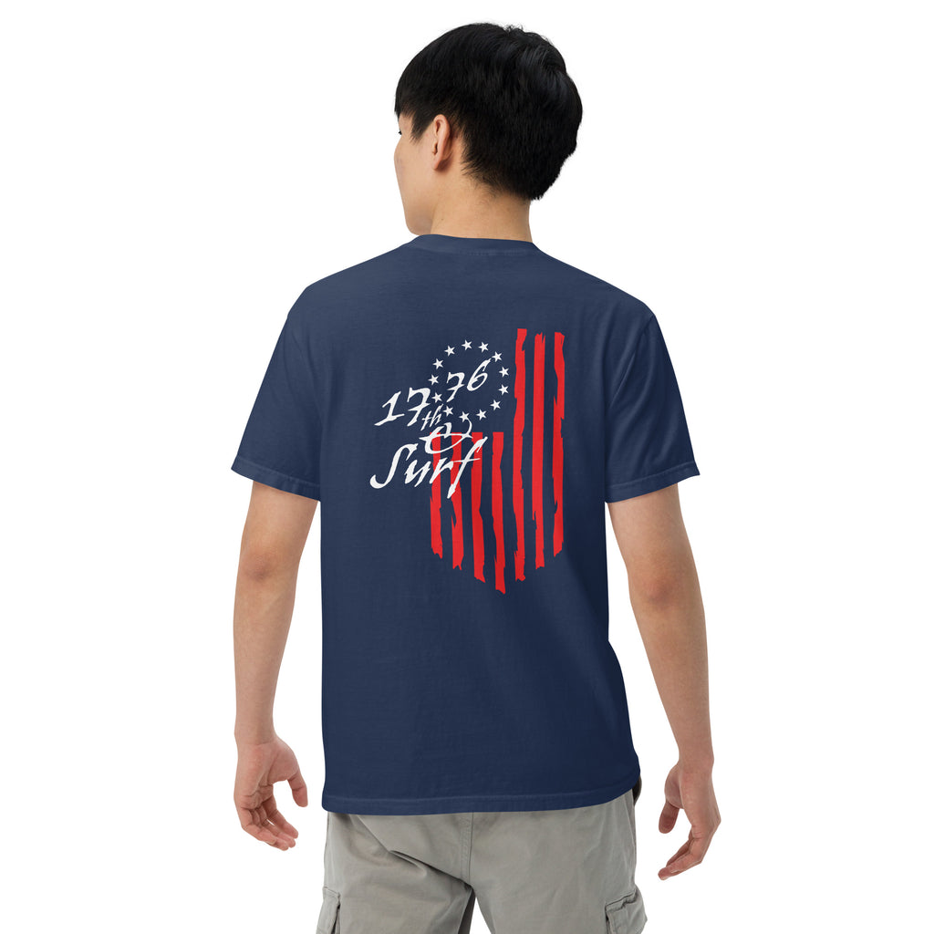 Man wearing the navy "1776 & Surf" tee, back view, featuring the large 1776 script logo with 13-star Betsy Ross flag and distressed red stripe graphic – America's 250th Anniversary Collection by 17th & Surf