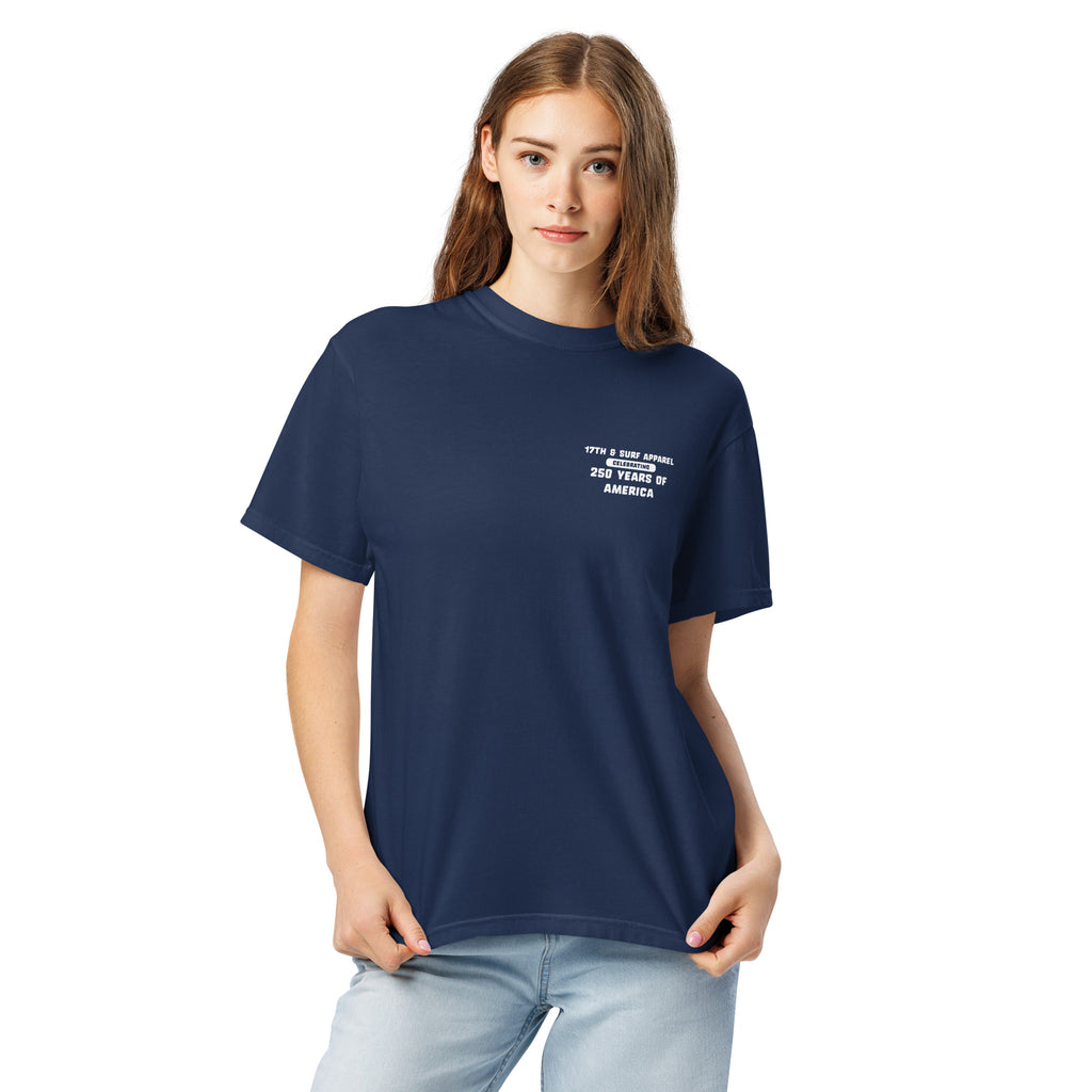 Woman wearing the navy "1776 & Surf" tee, front view, featuring the small '17TH & SURF APPAREL Celebrating 250 Years of America' chest wordmark – America's 250th Anniversary Collection by 17th & Surf