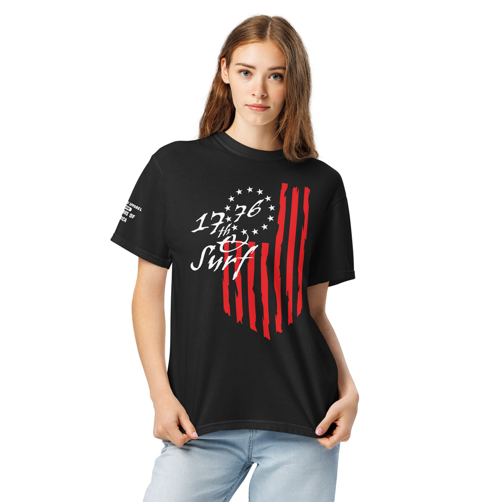 Woman wearing the black "1776 & Surf" tee - front print, front view, featuring the large 1776 script logo with 13-star Betsy Ross flag and distressed red stripe graphic – America's 250th Anniversary Collection by 17th & Surf