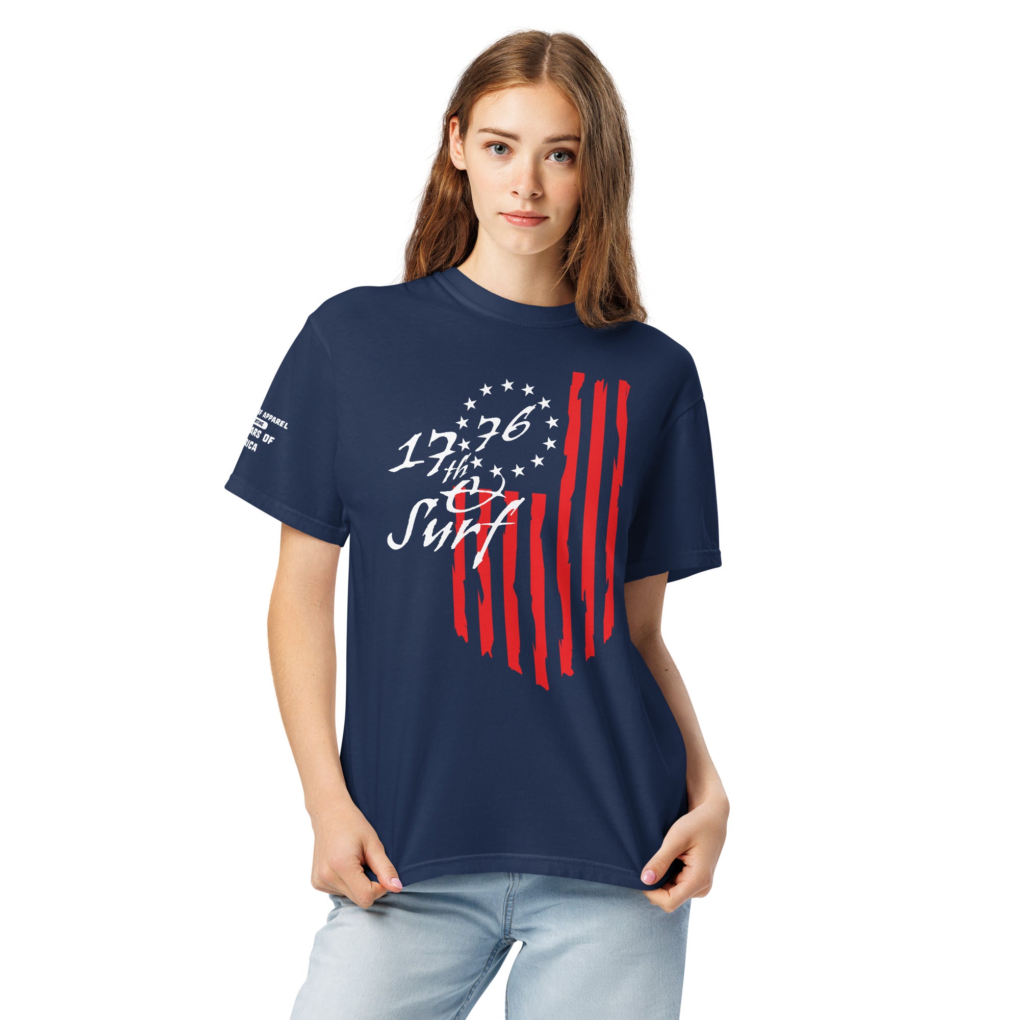 Woman wearing the navy "1776 & Surf" tee - front print, front view, featuring the large 1776 script logo with 13-star Betsy Ross flag and distressed red stripe graphic – America's 250th Anniversary Collection by 17th & Surf