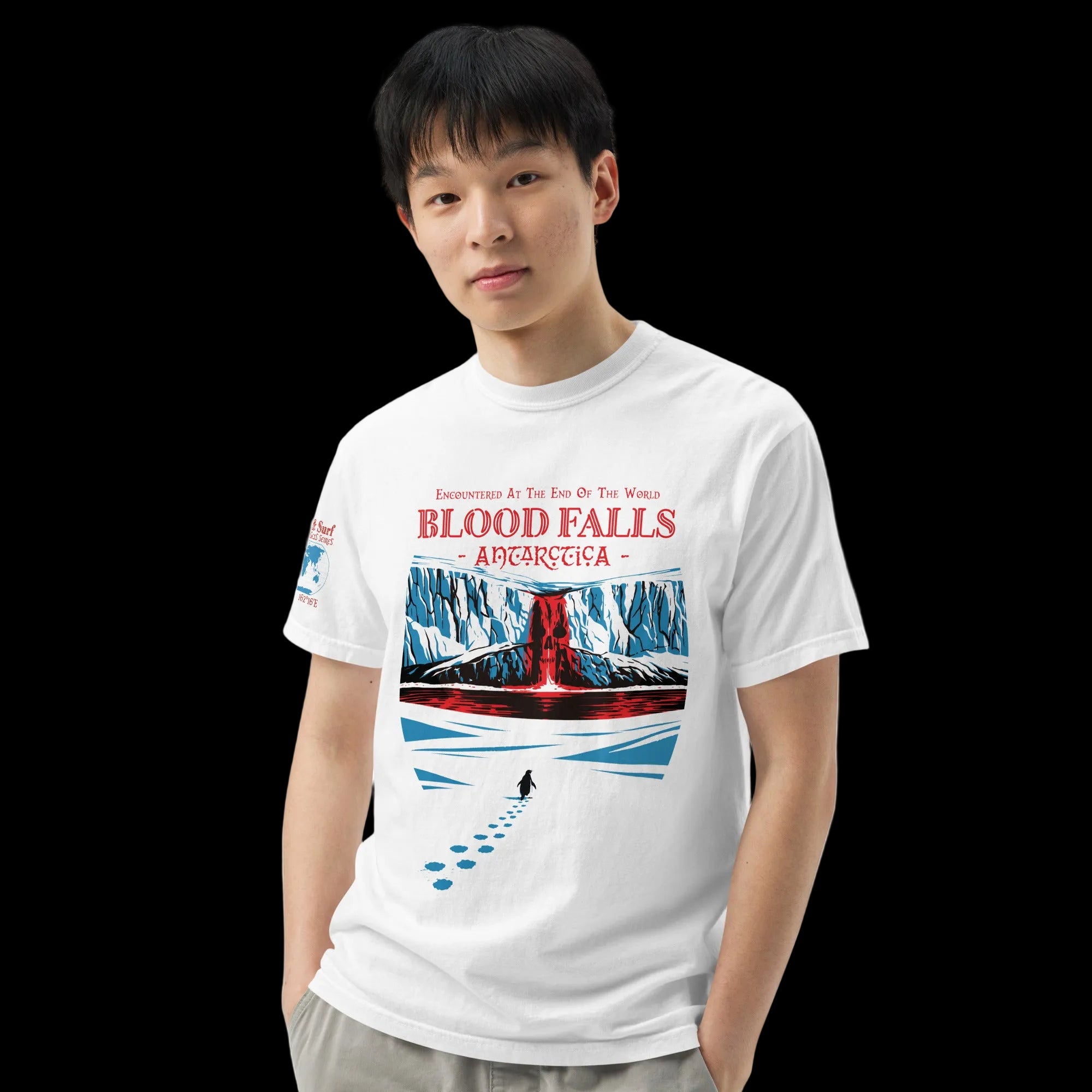 Male model wearing Blood Falls Antarctica Lone Penguin walking towards Red Waterfall Graphic Shirt by 17th & Surf