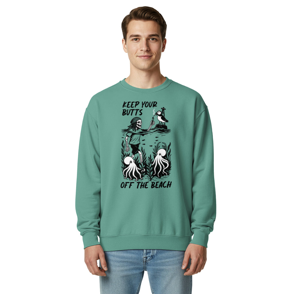 "Keep Your Butts Off The Beach" heavyweight crewneck sweatshirt front view in seafoam on model featuring skeleton lighting a cigarette for a puffin with octopuses in seaweed graphic - 17th & Surf