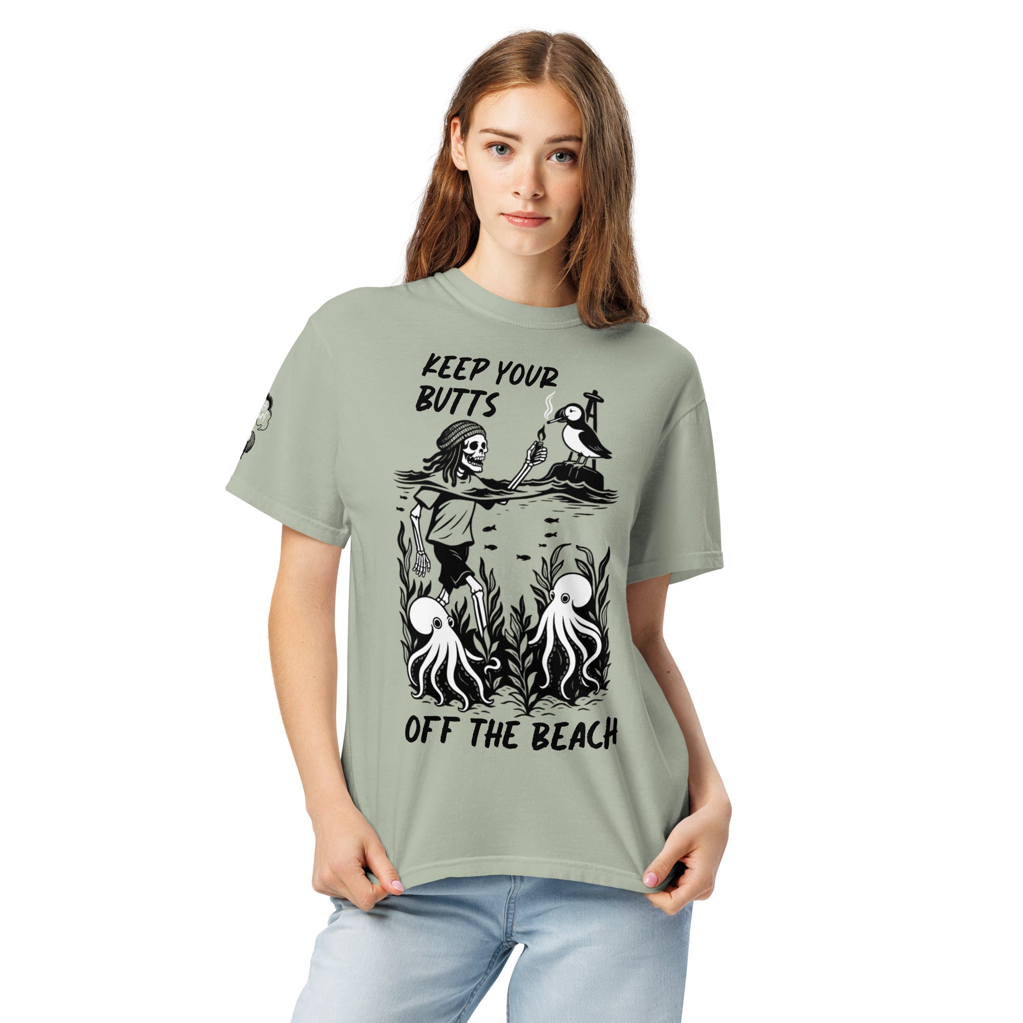"Keep Your Butts Off The Beach" front print garment-dyed heavyweight tee front view in bay featuring skeleton lighting a cigarette for a puffin with octopuses in seaweed graphic - 17th & Surf