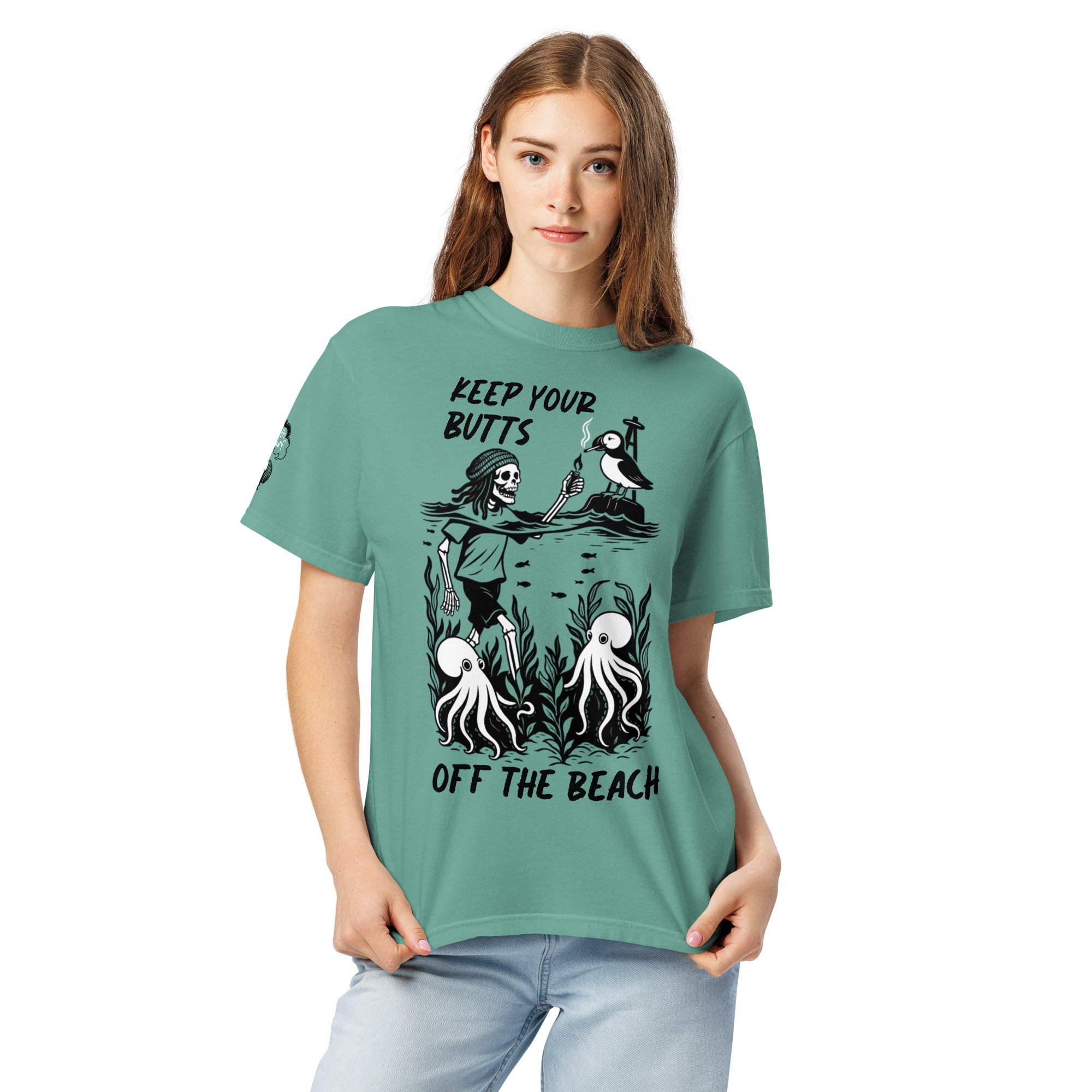 "Keep Your Butts Off The Beach" front print garment-dyed heavyweight tee second front view in seafoam featuring skeleton lighting a cigarette for a puffin with octopuses in seaweed graphic - 17th & Surf