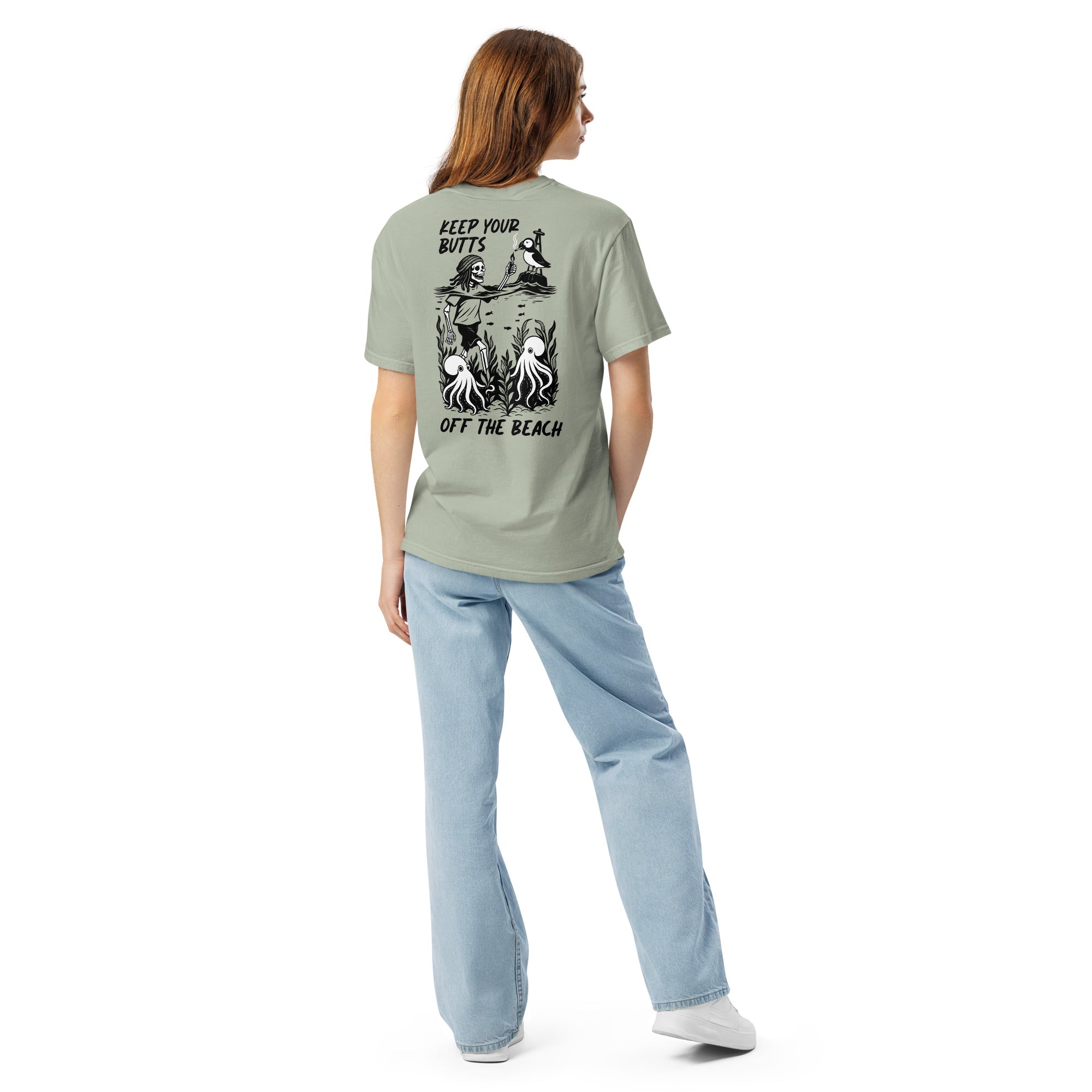 "Keep Your Butts Off The Beach" garment-dyed heavyweight tee back view in bay on model featuring skeleton lighting a cigarette for a puffin with octopuses in seaweed graphic - 17th & Surf