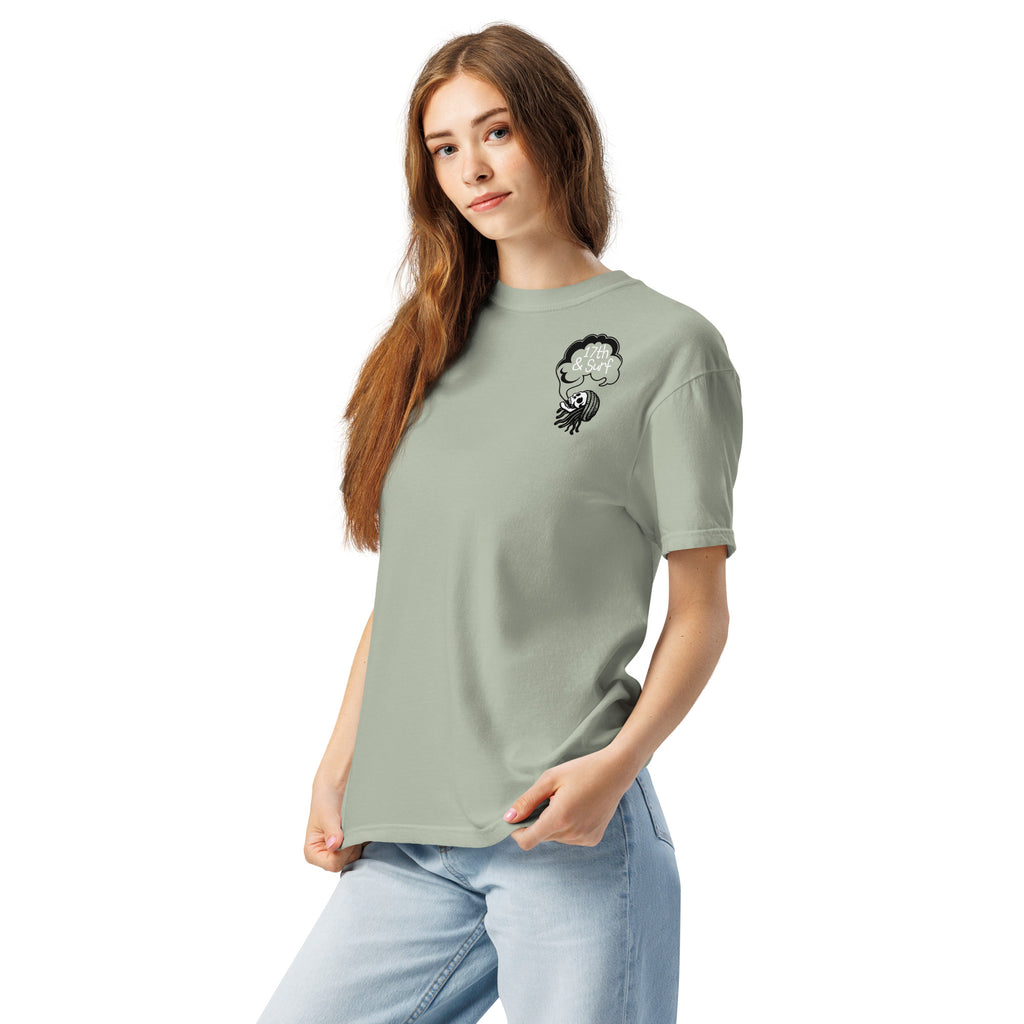 "Keep Your Butts Off The Beach" garment-dyed heavyweight tee front view in bay on model showing small smoking-skull chest logo with "17th & Surf" cloud - 17th & Surf