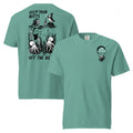 "Keep Your Butts Off The Beach" garment-dyed heavyweight tee in seafoam, front and back flat lay, featuring a skeleton lighting a cigarette for a puffin with octopuses in seaweed and "Keep Your Butts Off The Beach" text on the back and a small smoking-skull chest logo on the front - 17th & Surf