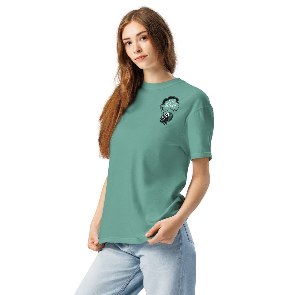 "Keep Your Butts Off The Beach" garment-dyed heavyweight tee left front angle in seafoam showing small smoking-skull chest logo with "17th & Surf" cloud - 17th & Surf