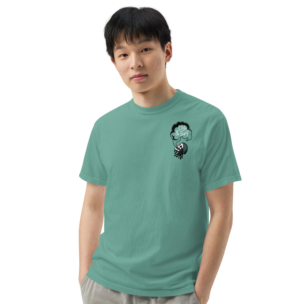 "Keep Your Butts Off The Beach" garment-dyed heavyweight tee front view in seafoam showing small smoking-skull chest logo with "17th & Surf" cloud - 17th & Surf
