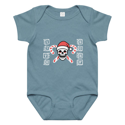 "Candy Cane Crossbones" baby short sleeve onesie in vintage indigo, front view featuring "17th & Surf" skull logo wearing a Santa hat with crossed candy canes and alphabet block lettering spelling "17TH" and "SURF" – 17th & Surf