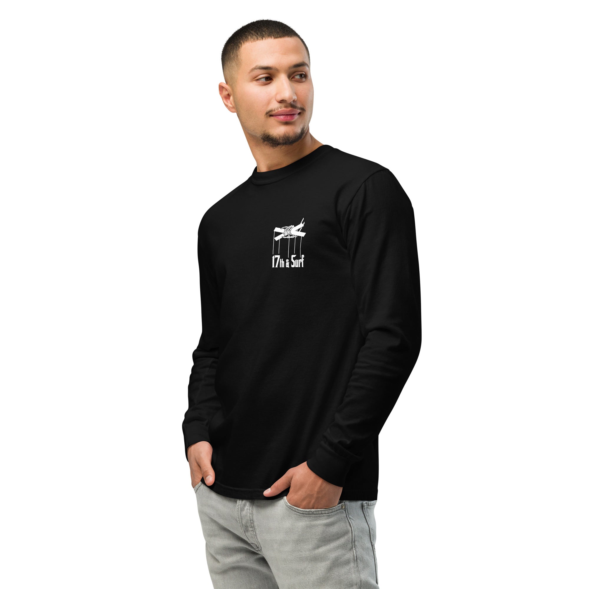"Clam's Casino" garment-dyed heavyweight long sleeve shirt in black, front angle view, featuring the small "17th & Surf" skeletal puppeteer-hand logo on the chest – Clam's Casino Series by 17th & Surf