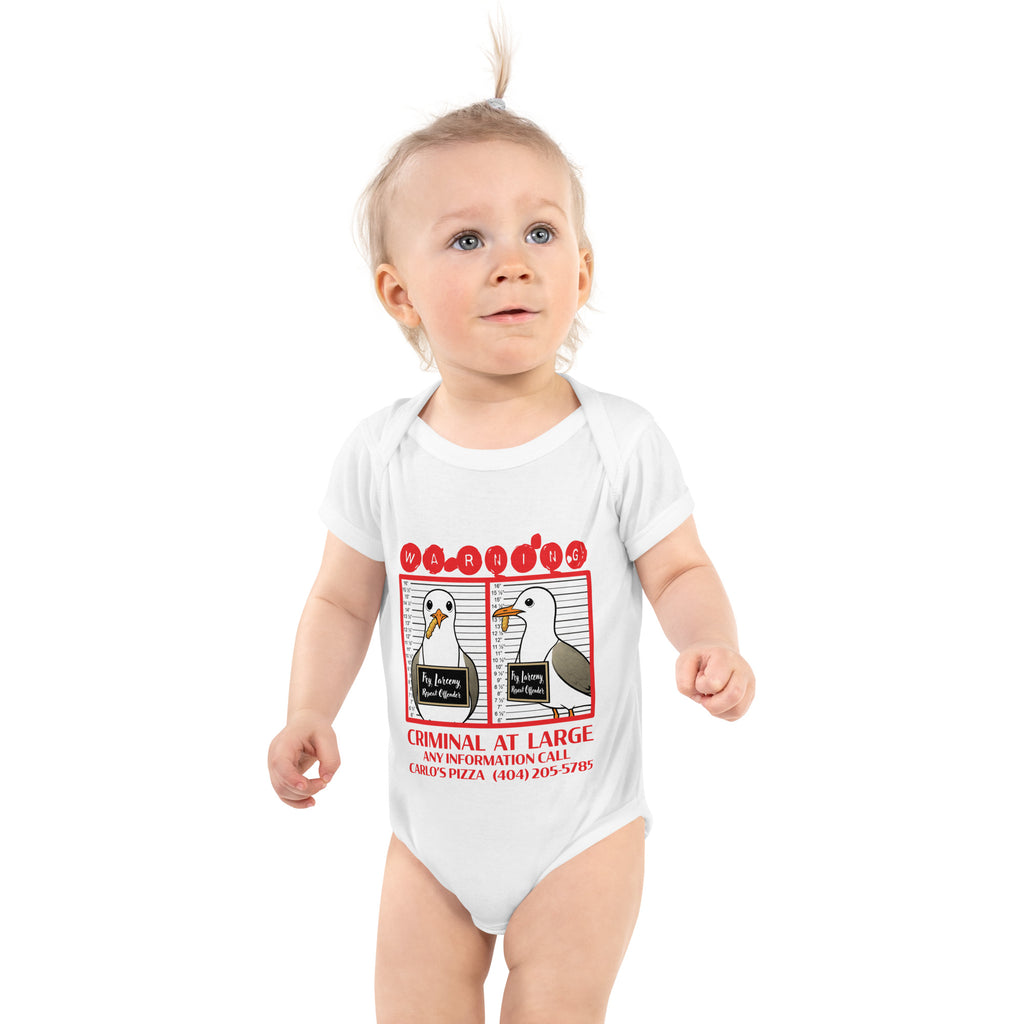 "Criminal At Large" white baby short sleeve onesie on toddler model, featuring seagull "WARNING" mugshot graphic with "Fry Larceny, Repeat Offender" police lineup – 17th & Surf x Carlo's Pizza