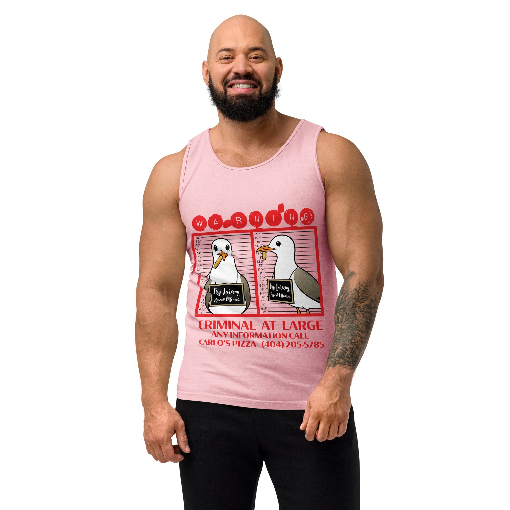 "Criminal At Large" pink tank top on male model, front view, featuring seagull "WARNING" mugshot graphic with "Fry Larceny, Repeat Offender" police lineup – 17th & Surf x Carlo's Pizza