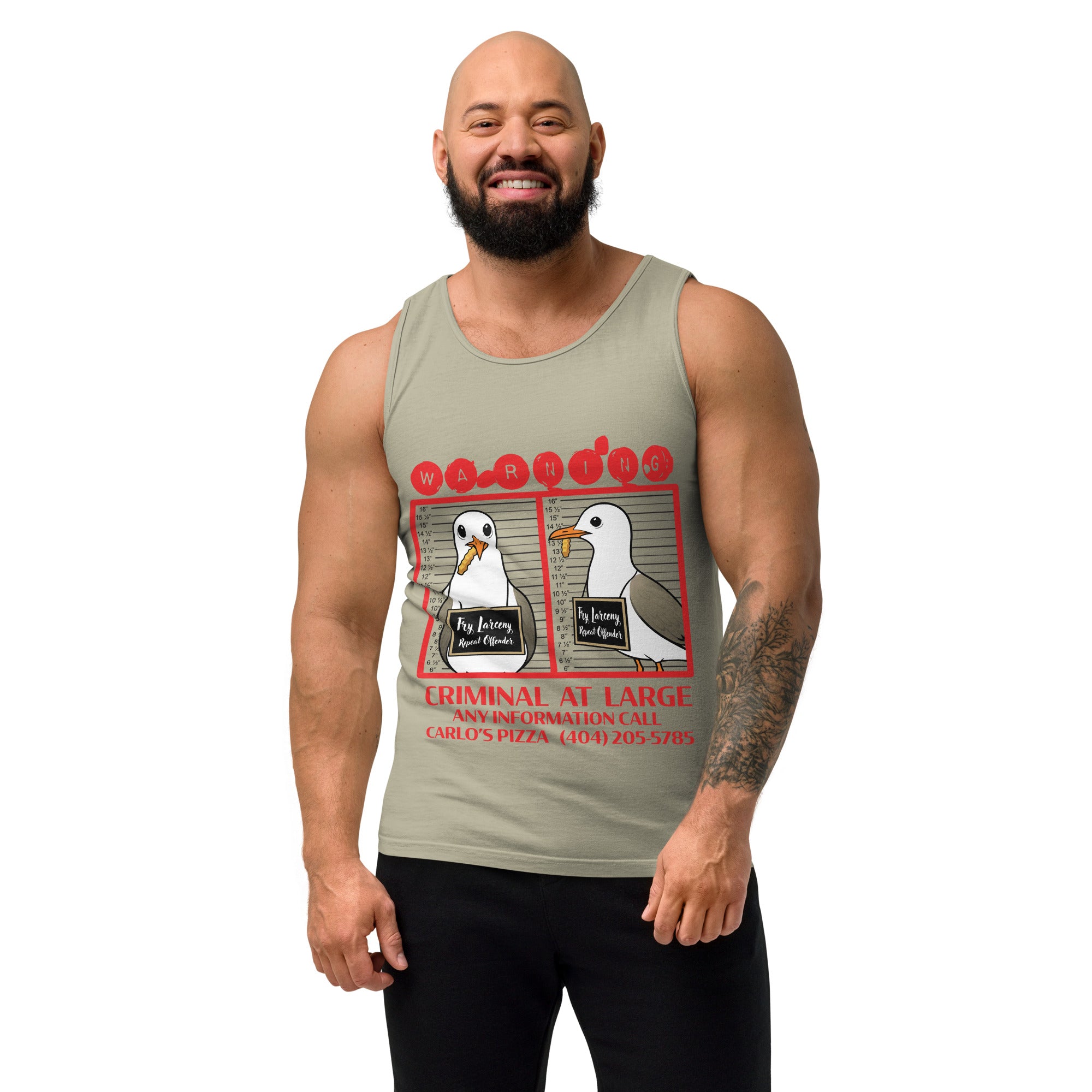 "Criminal At Large" sandstone tank top on male model, front view, featuring seagull "WARNING" mugshot graphic with "Fry Larceny, Repeat Offender" police lineup – 17th & Surf x Carlo's Pizza