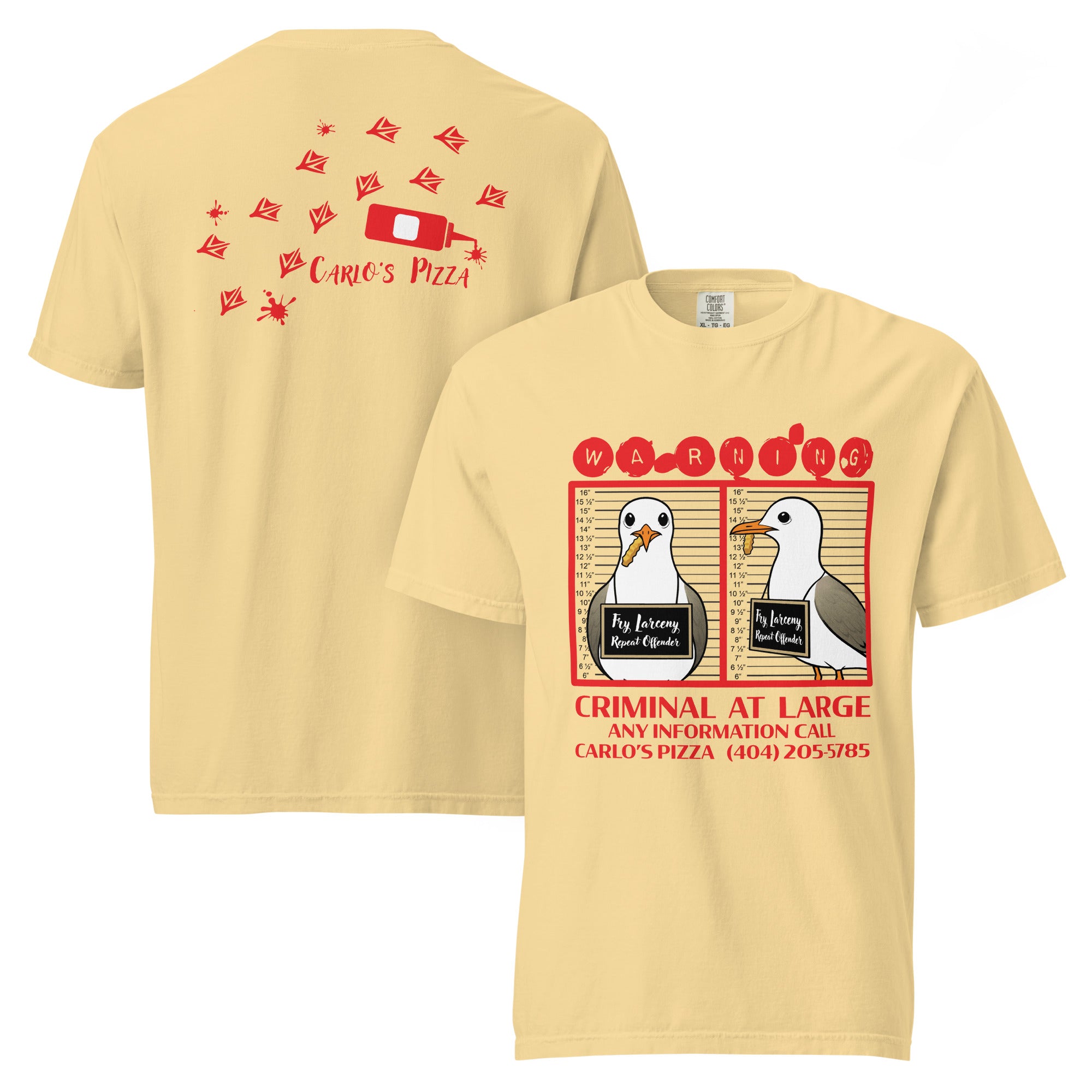 "Criminal At Large" pale yellow garment-dyed heavyweight tee, front and back flat lay, featuring seagull "WARNING" mugshot graphic on front and Carlo's Pizza footprint design on back – 17th & Surf x Carlo's Pizza