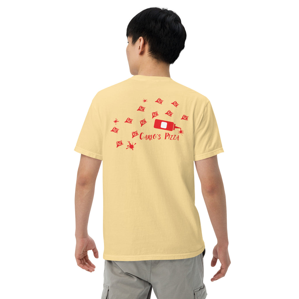 "Criminal At Large" pale yellow garment-dyed heavyweight tee on male model, back view, featuring red seagull footprint trail and Carlo's Pizza ketchup bottle design – 17th & Surf x Carlo's Pizza