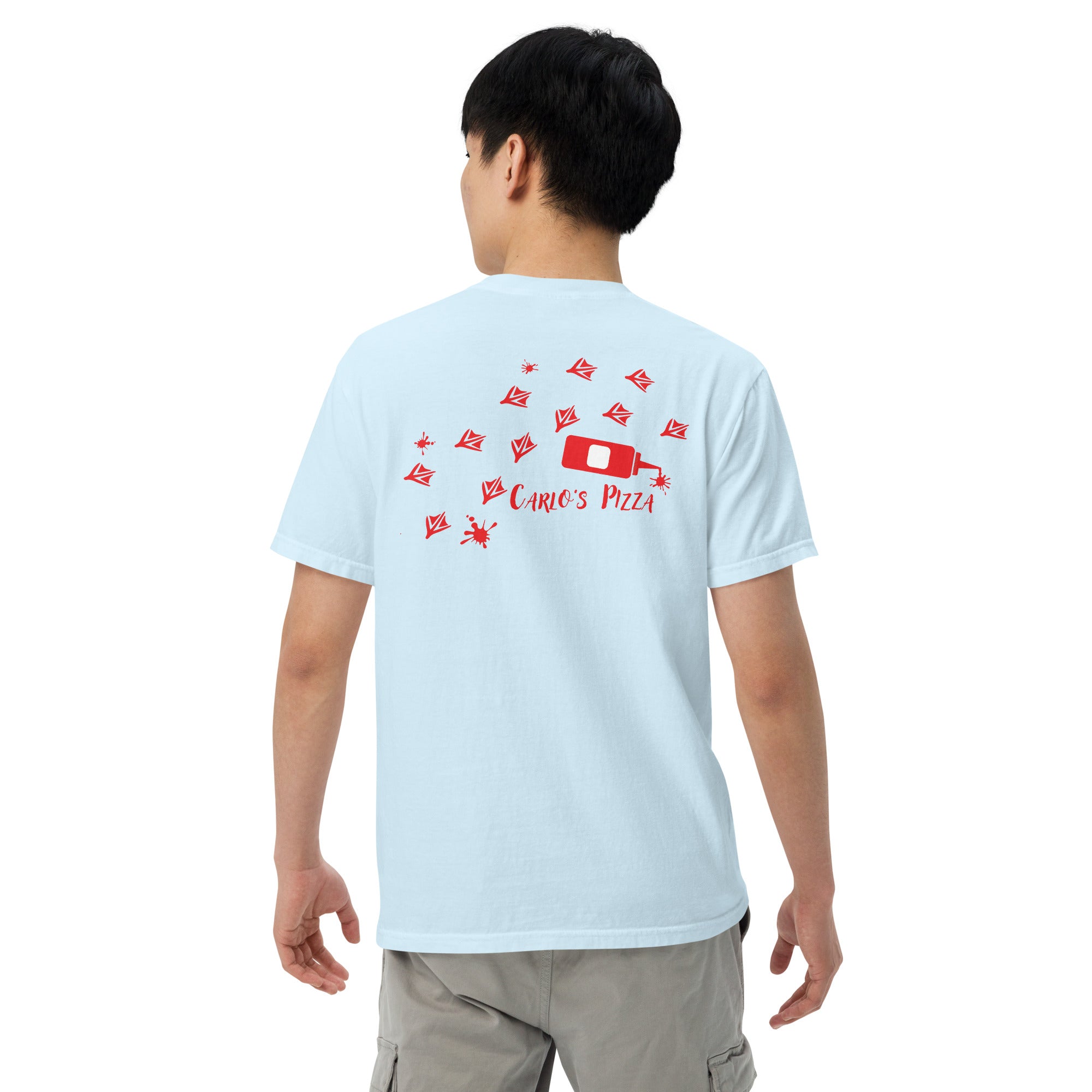 "Criminal At Large" light blue garment-dyed heavyweight tee on male model, back view, featuring red seagull footprint trail and Carlo's Pizza ketchup bottle design – 17th & Surf x Carlo's Pizza