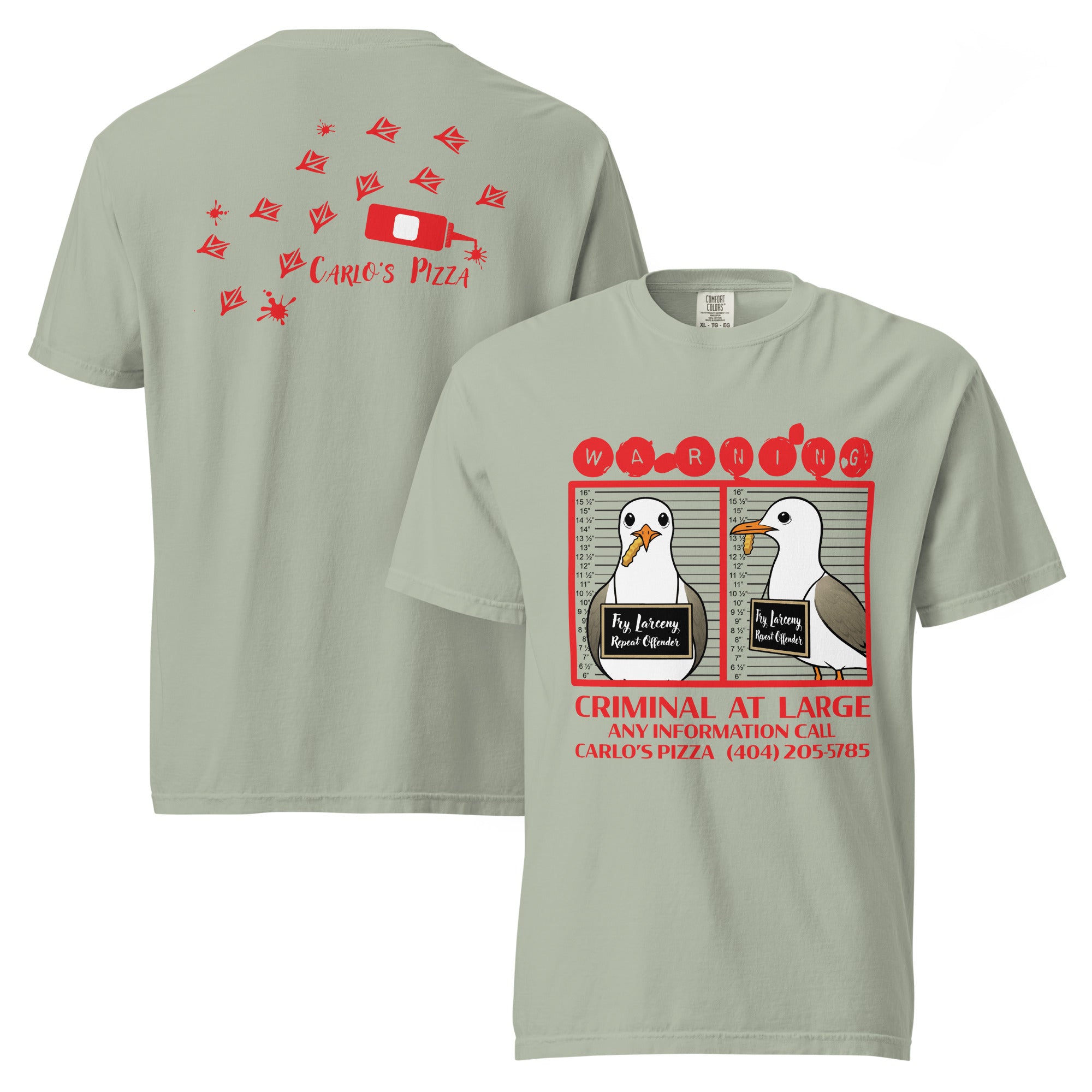 "Criminal At Large" sage green garment-dyed heavyweight tee, front and back flat lay, featuring seagull "WARNING" mugshot graphic on front and Carlo's Pizza footprint design on back – 17th & Surf x Carlo's Pizza