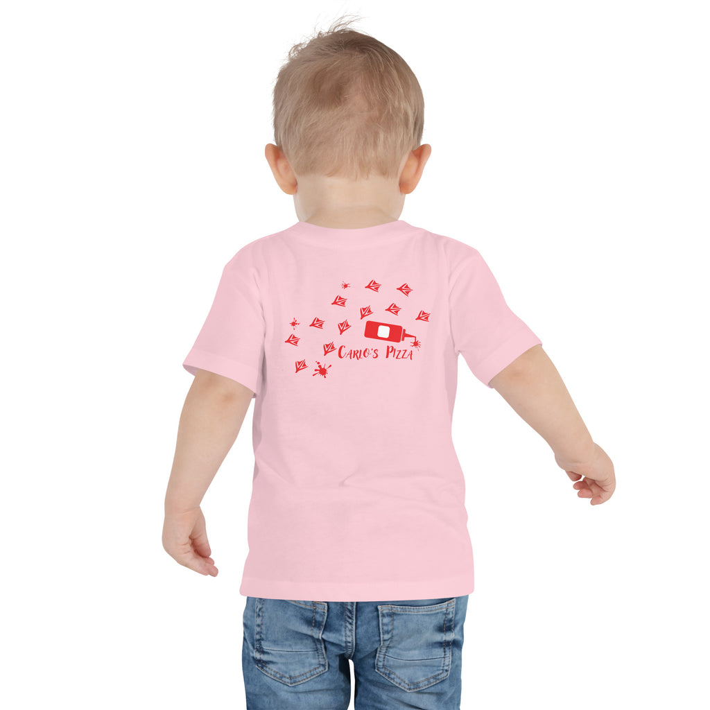 "Criminal At Large" pink toddler tee on toddler model, back view, featuring red seagull footprint trail and Carlo's Pizza ketchup bottle design – 17th & Surf x Carlo's Pizza