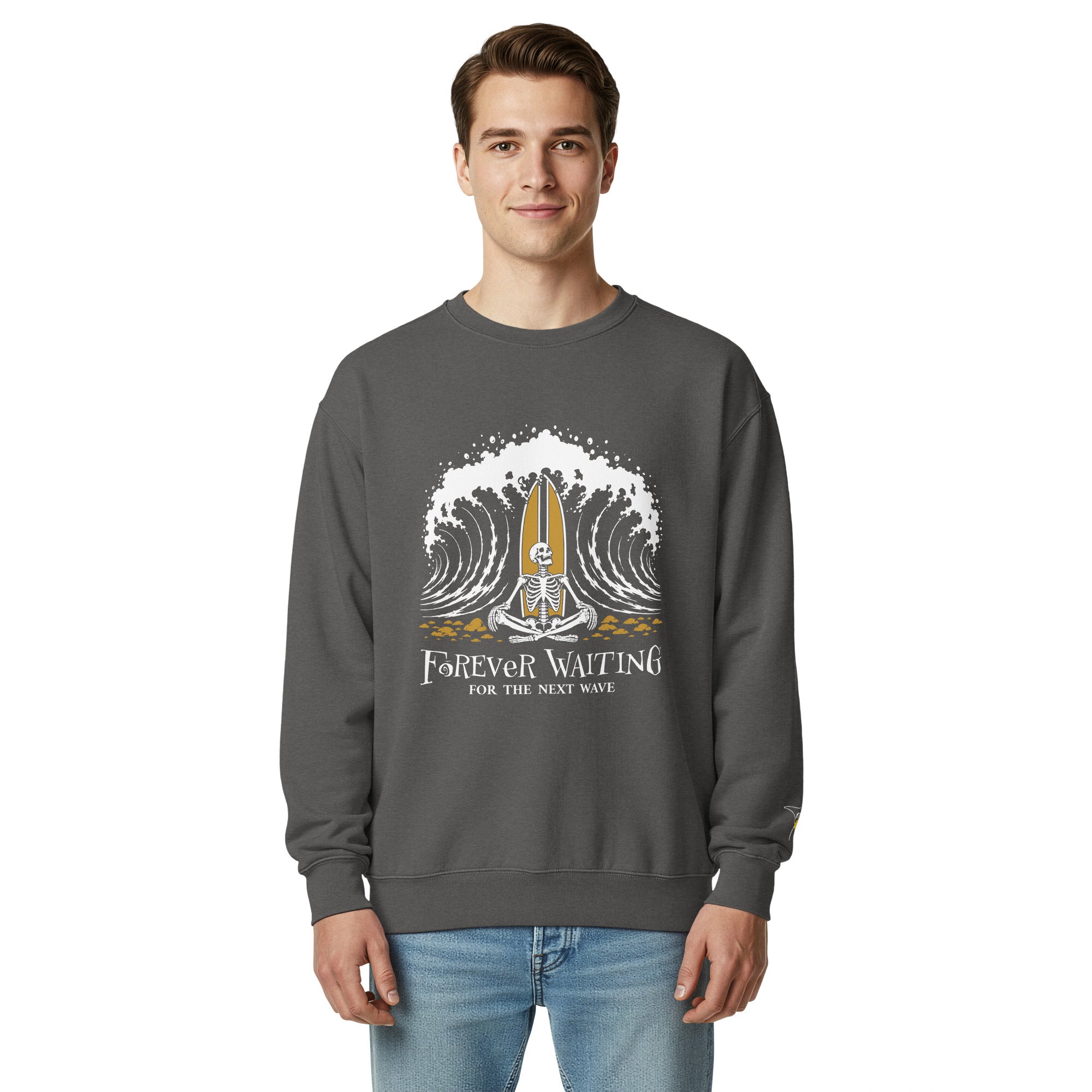 "Forever Waiting For The Next Wave" crewneck sweatshirt, Pepper, second front view, featuring a meditating skeleton surfer, board planted upright behind him, sitting cross-legged on the shore as breakers roll in on either side – 17th & Surf