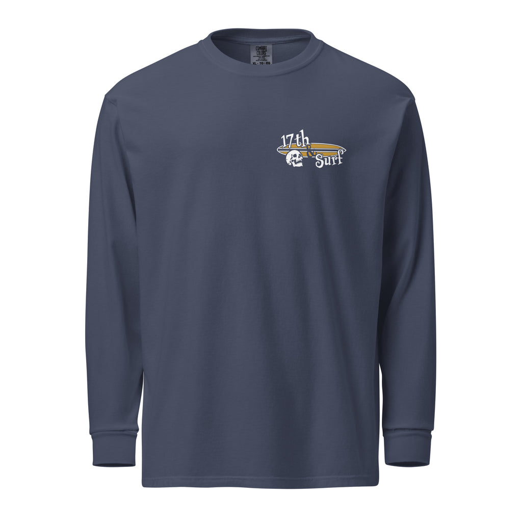 "Forever Waiting For The Next Wave" long sleeve shirt, Navy, front view, featuring a meditating skeleton surfer, board planted upright behind him, sitting cross-legged on the shore as breakers roll in on either side – 17th & Surf