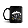 "Forever Waiting For The Next Wave" black glossy 11oz mug, handle on left, featuring a meditating skeleton surfer, board planted upright behind him, sitting cross-legged on the shore as breakers roll in on either side – 17th & Surf