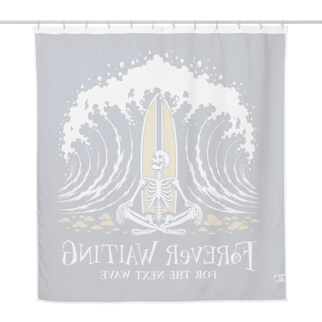 "Forever Waiting For The Next Wave" shower curtain, back view, featuring a meditating skeleton surfer, board planted upright behind him, sitting cross-legged on the shore as breakers roll in on either side – 17th & Surf