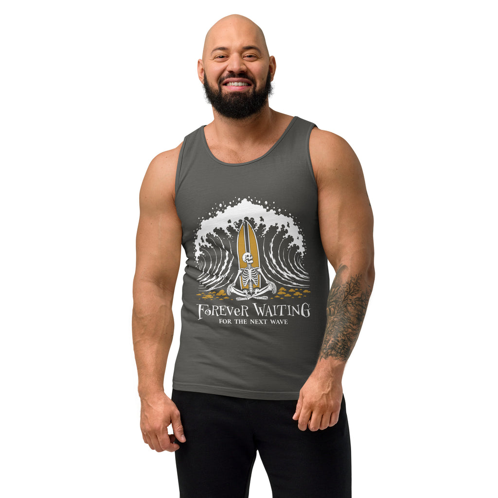 "Forever Waiting For The Next Wave" tank top, Pepper, second front view, featuring a meditating skeleton surfer, board planted upright behind him, sitting cross-legged on the shore as breakers roll in on either side – 17th & Surf