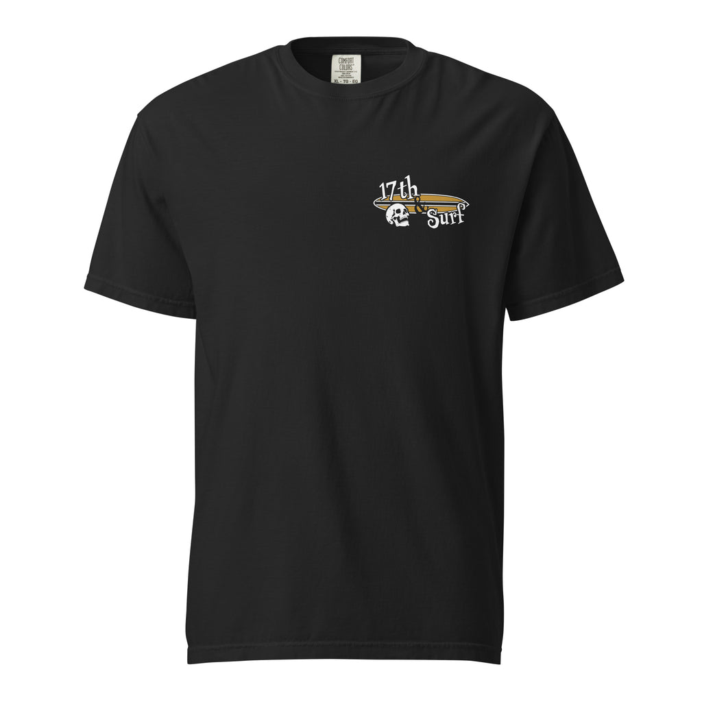 "Forever Waiting For The Next Wave" tee, Black, front view, featuring a meditating skeleton surfer, board planted upright behind him, sitting cross-legged on the shore as breakers roll in on either side – 17th & Surf