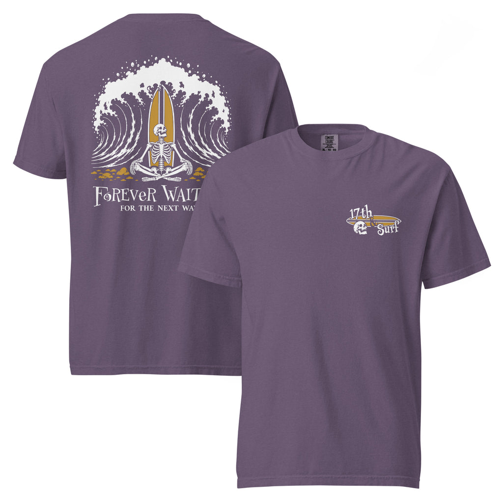 "Forever Waiting For The Next Wave" tee, Grape, front and back flat lay, featuring a meditating skeleton surfer, board planted upright behind him, sitting cross-legged on the shore as breakers roll in on either side – 17th & Surf