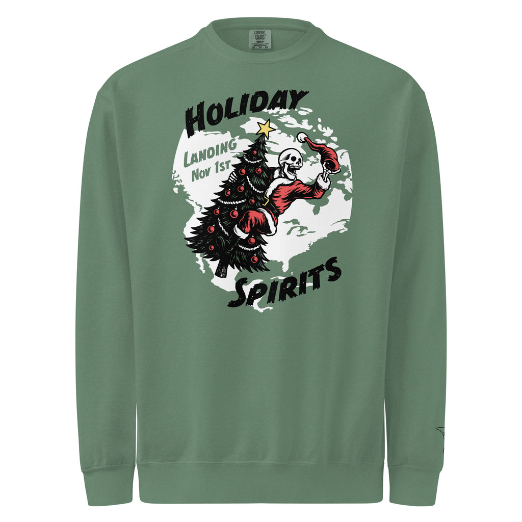 Model wearing "Holiday Spirits" heavyweight crewneck sweatshirt in light green, front view featuring full color graphic of a skeleton Santa riding a decorated Christmas tree inside a white splatter map shape with arched "Holiday" and "Spirits" text and "Landing Nov 1st" – 17th & Surf