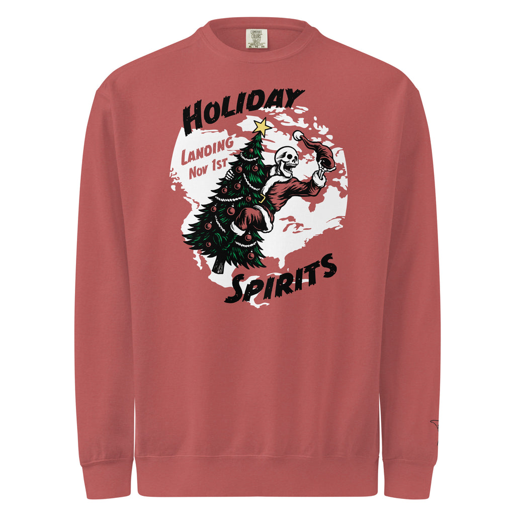 Model wearing "Holiday Spirits" heavyweight crewneck sweatshirt in crimson red, front view featuring full color graphic of a skeleton Santa riding a decorated Christmas tree inside a white splatter map shape with arched "Holiday" and "Spirits" text and "Landing Nov 1st" – 17th & Surf
