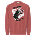 Model wearing "Holiday Spirits" heavyweight crewneck sweatshirt in crimson red, front view featuring full color graphic of a skeleton Santa riding a decorated Christmas tree inside a white splatter map shape with arched "Holiday" and "Spirits" text and "Landing Nov 1st" – 17th & Surf