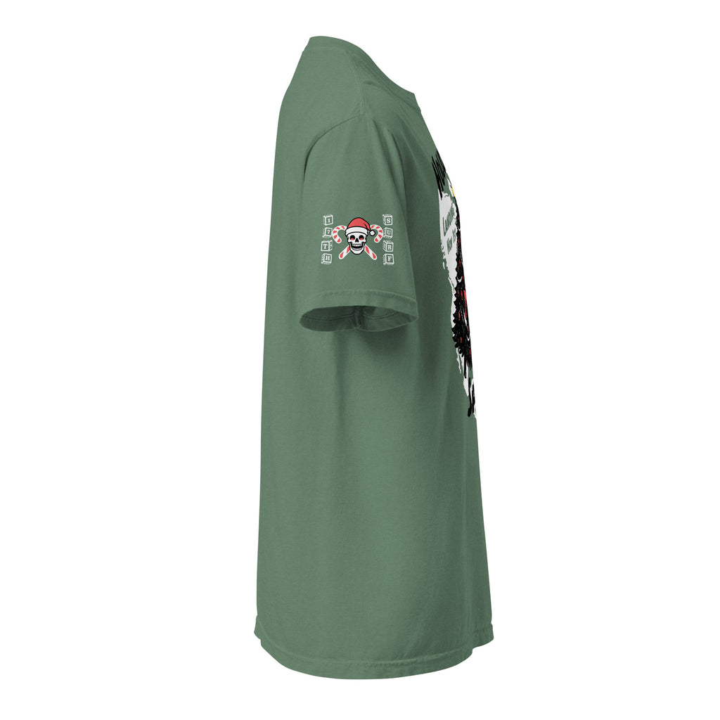 Model wearing "Holiday Spirits" front print garment-dyed heavyweight t-shirt in light green, second right angle view featuring full color graphic of a skeleton Santa riding a decorated Christmas tree with arched "Holiday" and "Spirits" text – 17th & Surf