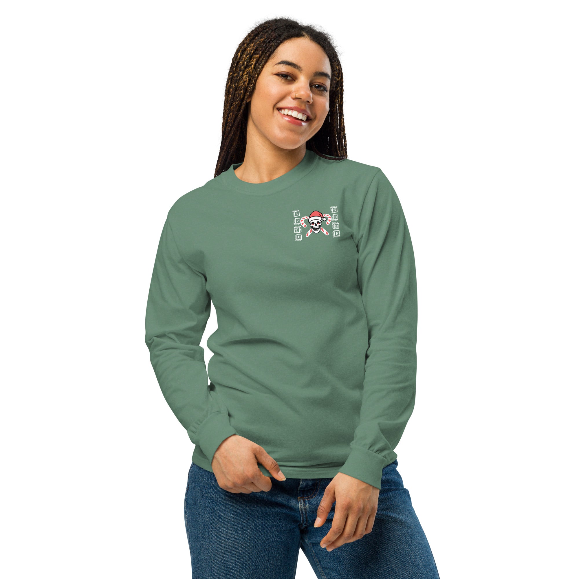 Model wearing "Holiday Spirits" garment-dyed heavyweight long sleeve shirt in sage green with small "17th & Surf" candy cane crossbones skull chest logo, front view – 17th & Surf