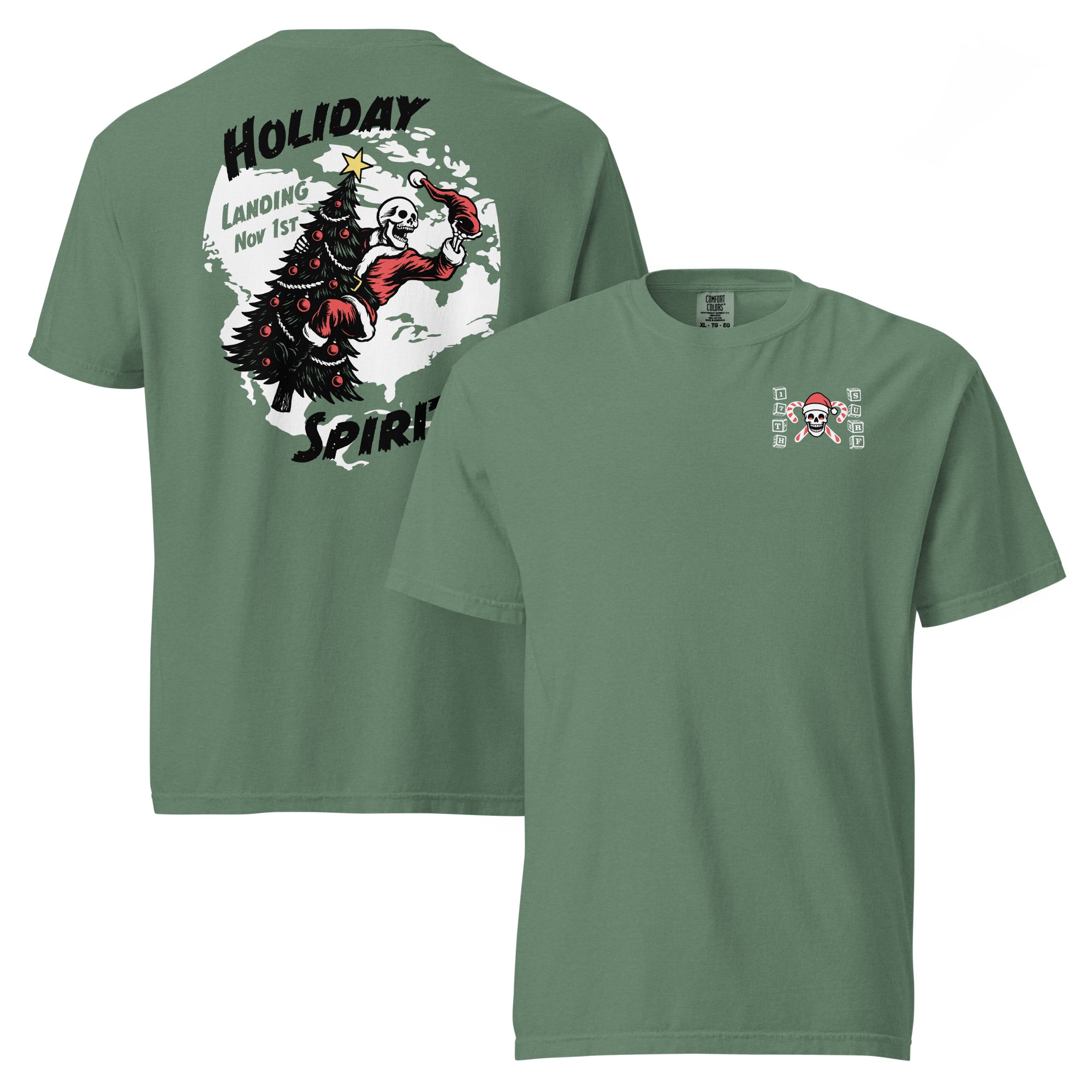 "Holiday Spirits" garment-dyed heavyweight t-shirt in light green, front and back flat lay featuring small "17th & Surf" candy cane crossbones skull chest logo on front and full color graphic on back of a skeleton Santa riding a decorated Christmas tree with arched "Holiday" and "Spirits" text and "Landing Nov 1st" – 17th & Surf
