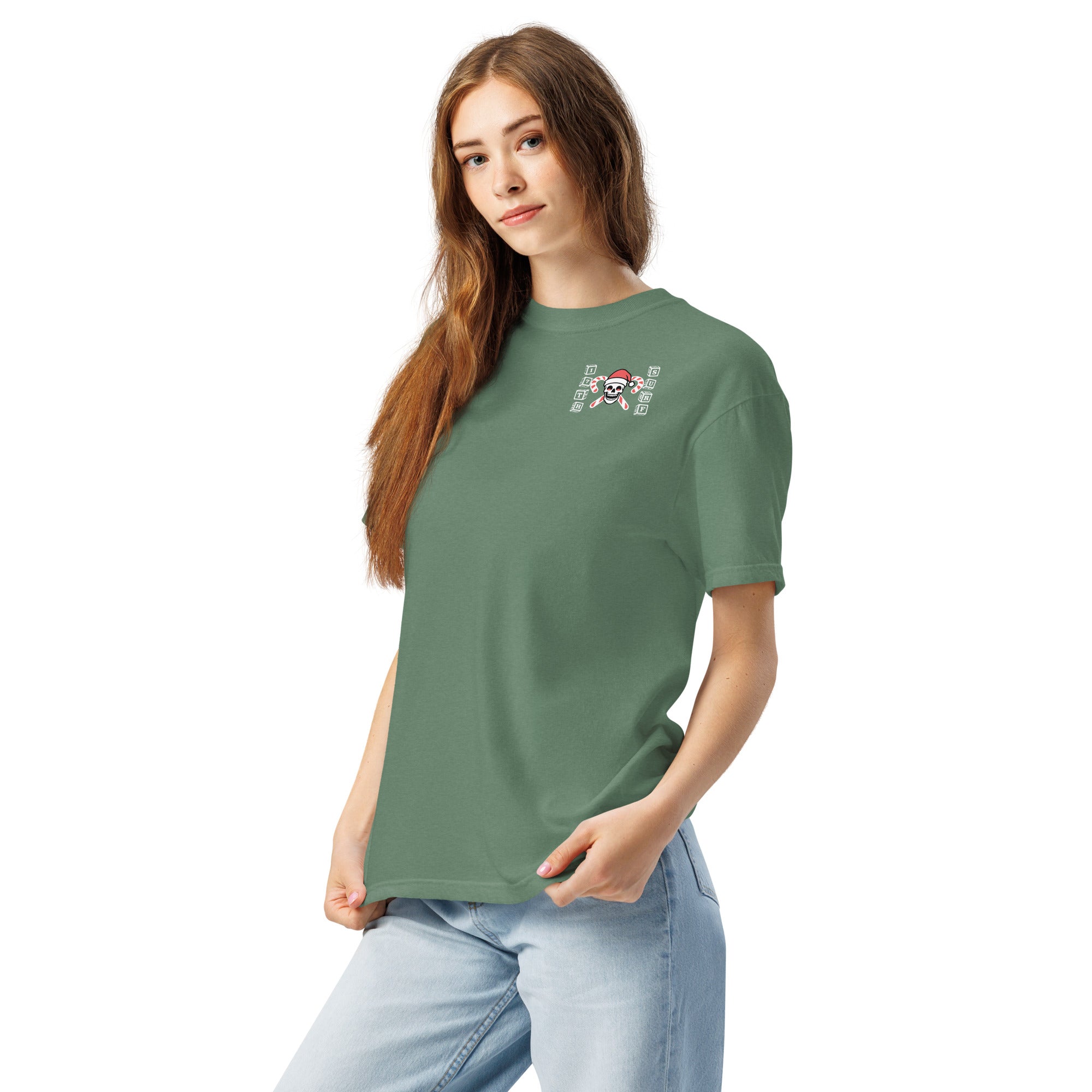 Model wearing "Holiday Spirits" garment-dyed heavyweight t-shirt in light green with small "17th & Surf" candy cane crossbones skull chest logo, front angle view – 17th & Surf
