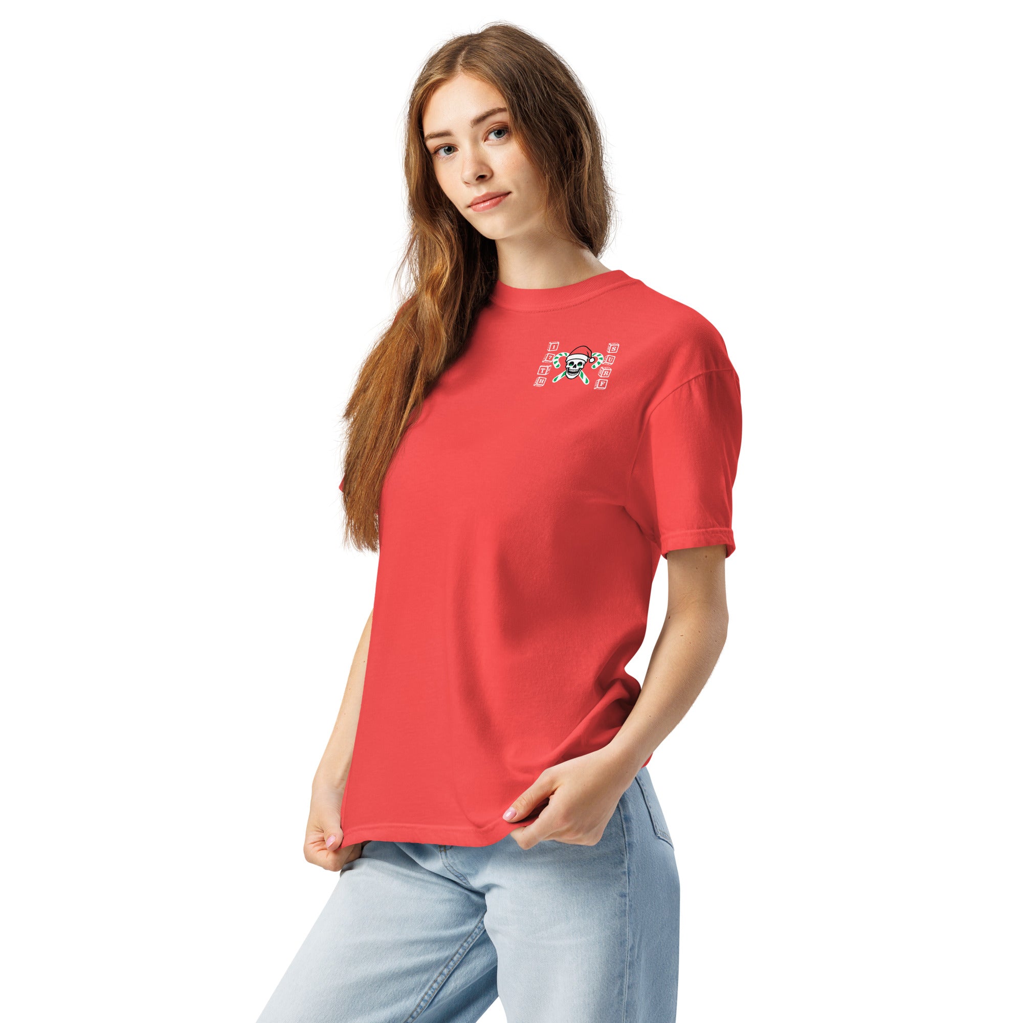 Model wearing "Holiday Spirits" garment-dyed heavyweight t-shirt in red with small "17th & Surf" candy cane crossbones skull chest logo, front angle view – 17th & Surf