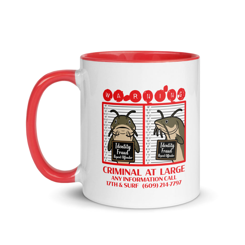 "Identity Fraud" white ceramic 11oz mug with red interior and handle, left view, featuring catfish "WARNING" mugshot graphic with "Identity Fraud, Repeat Offender" police lineup – 17th & Surf