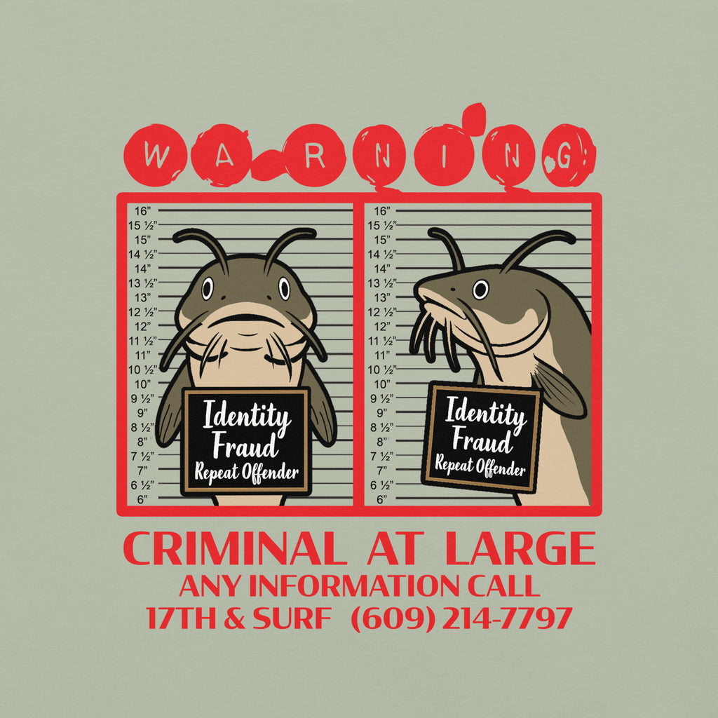"Identity Fraud" bay garment-dyed heavyweight tee, close-up of catfish "WARNING" mugshot graphic with "Identity Fraud, Repeat Offender" police lineup – 17th & Surf