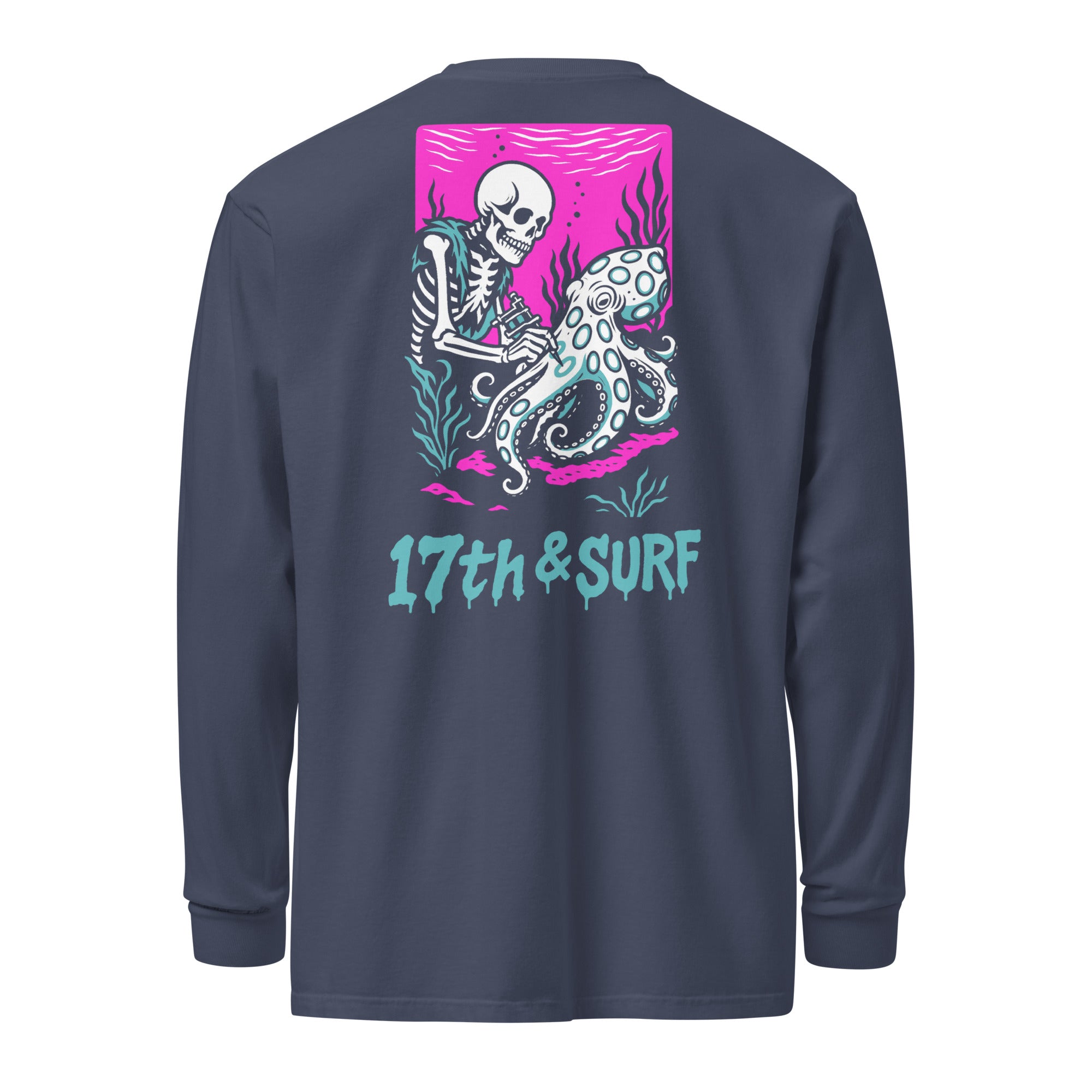 "Inked" garment-dyed heavyweight long sleeve back flat lay in true navy featuring skeleton tattooing an octopus graphic with "17th & Surf" text on pink background – 17th & Surf