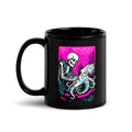 "Inked" 11oz black glossy mug with handle on left featuring skeleton tattooing an octopus graphic with "17th & Surf" text on pink background – 17th & Surf