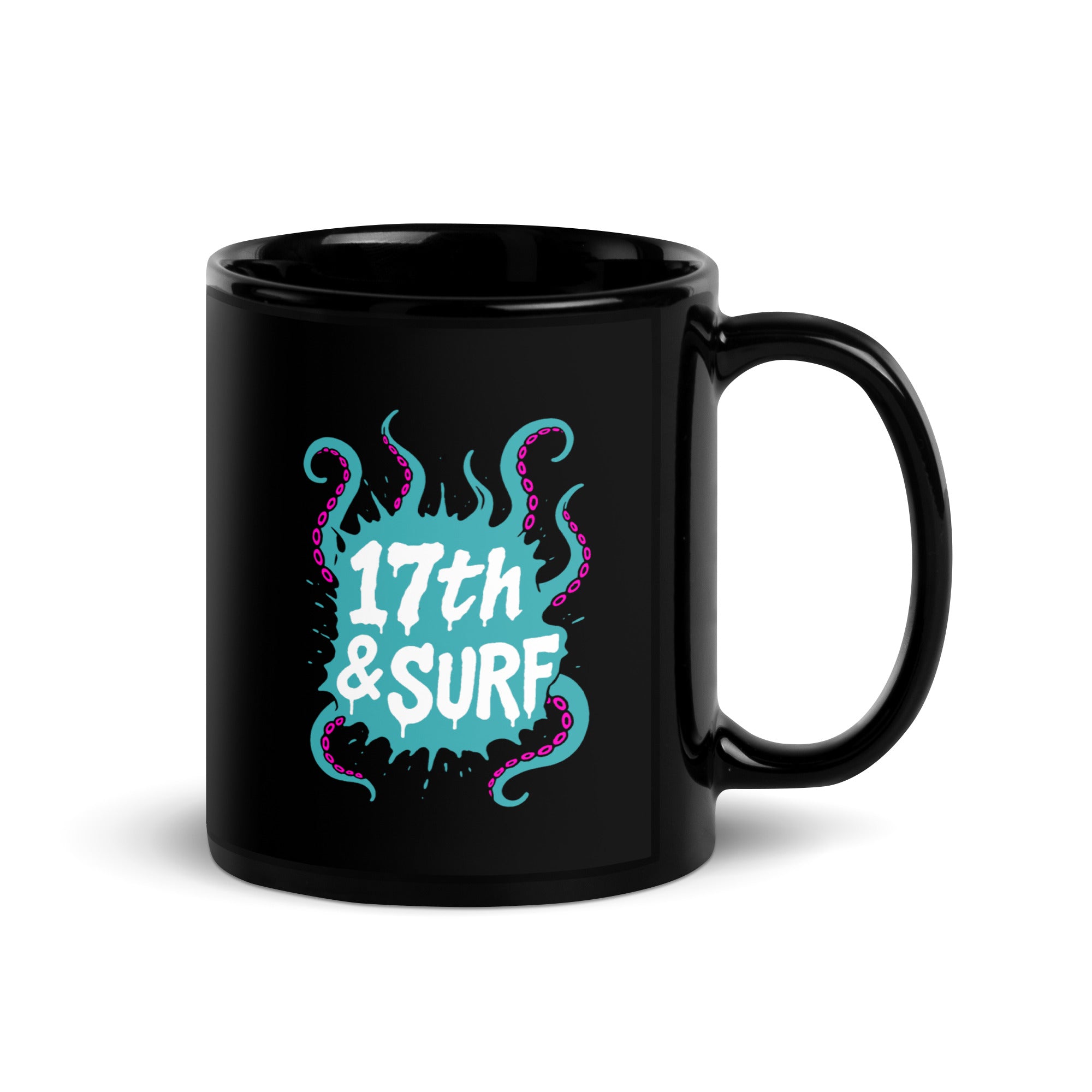 "Inked" 11oz black glossy mug with handle on right showing skeleton-and-tentacle "17th & Surf" logo – 17th & Surf