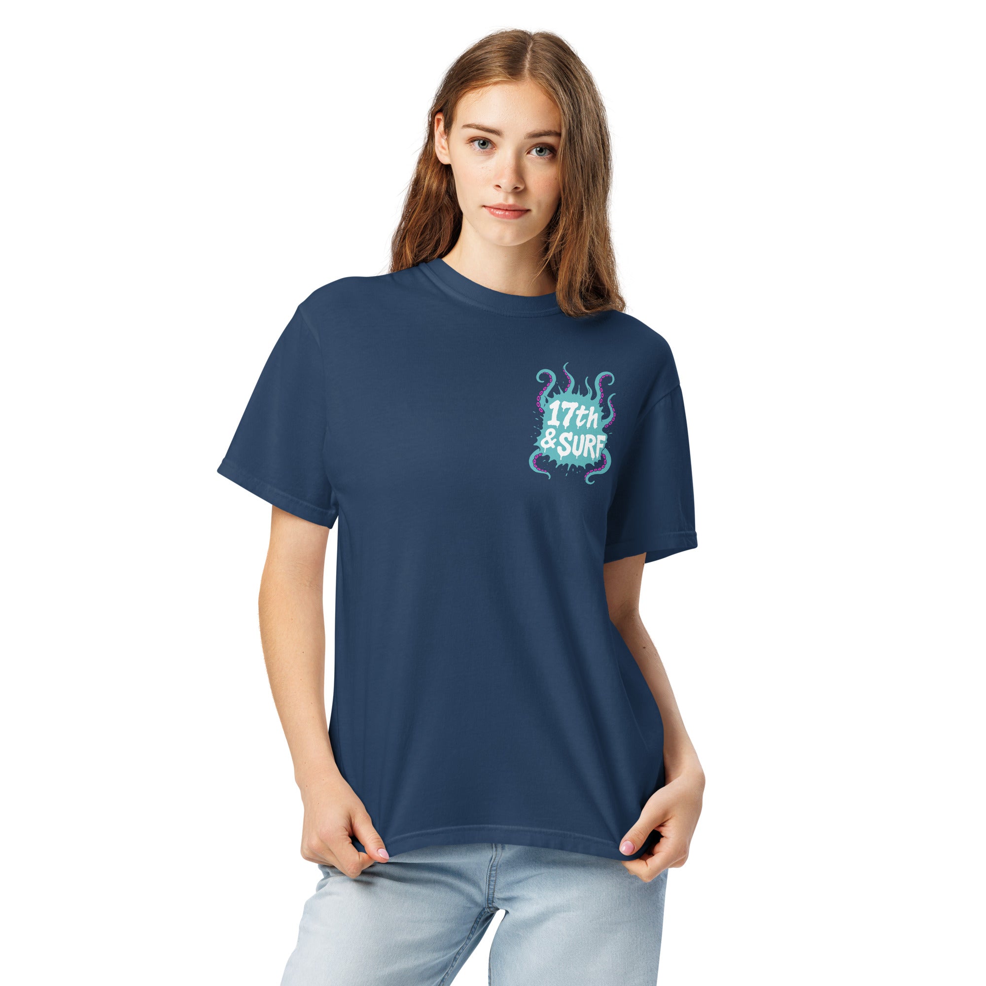 "Inked" garment-dyed heavyweight tee front view on female model in true navy showing small skeleton-and-tentacle "17th & Surf" chest logo – 17th & Surf