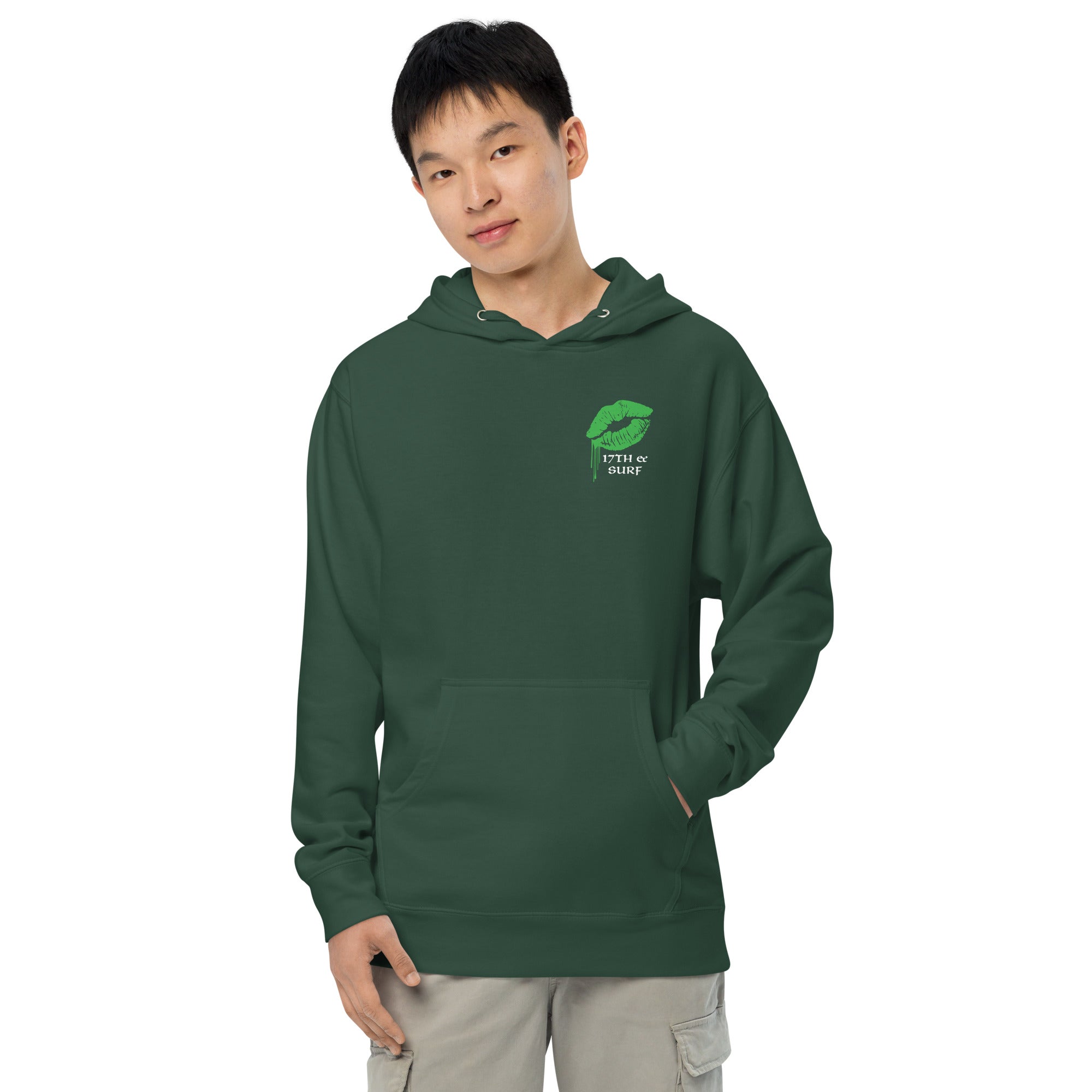 "Kiss Me I'm Irish" Anglerfish alpine green midweight hoodie on male model, front view, featuring a green dripping-lips "17TH & SURF" logo on the chest – 17th & Surf